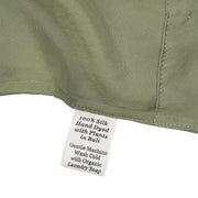 Close-up of a silk in Bark with a label detailing care instructions